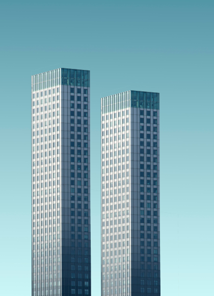 two buildings against clear blue sky